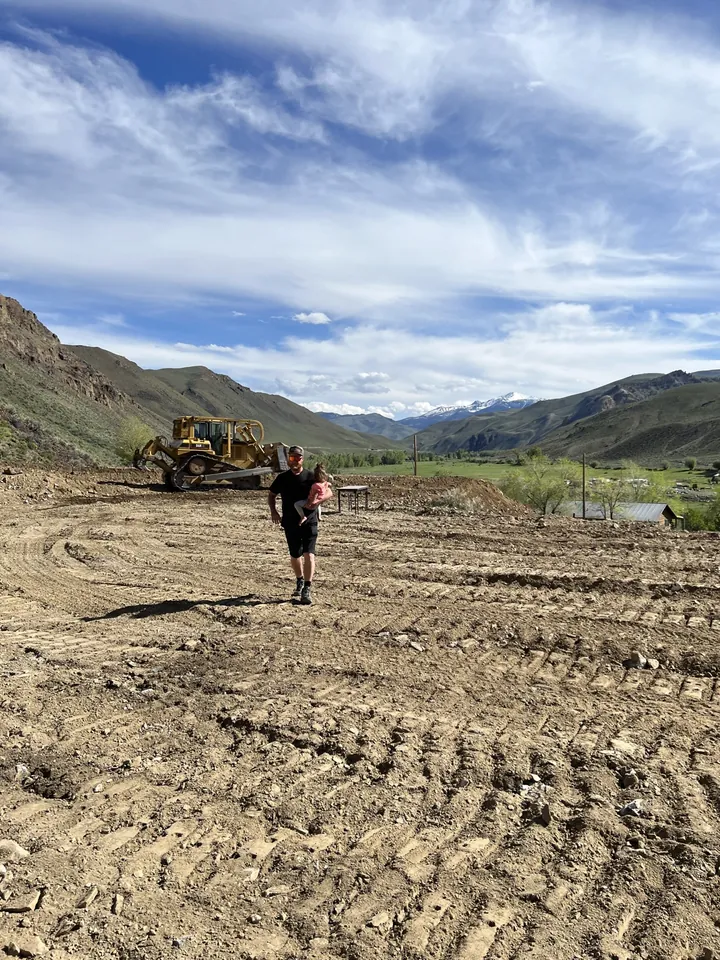 Peter and his daughter at the cleared Clayton, Idaho building pad